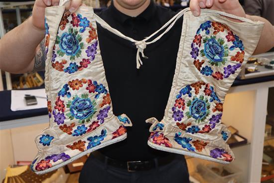 A Chinese embroidered skirt, a pair of embroidered boots, waistcoat and cover